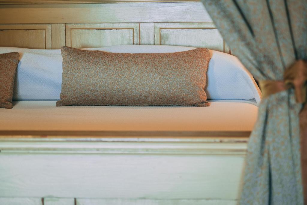 Postel nebo postele na pokoji v ubytování Hotel Carabeo