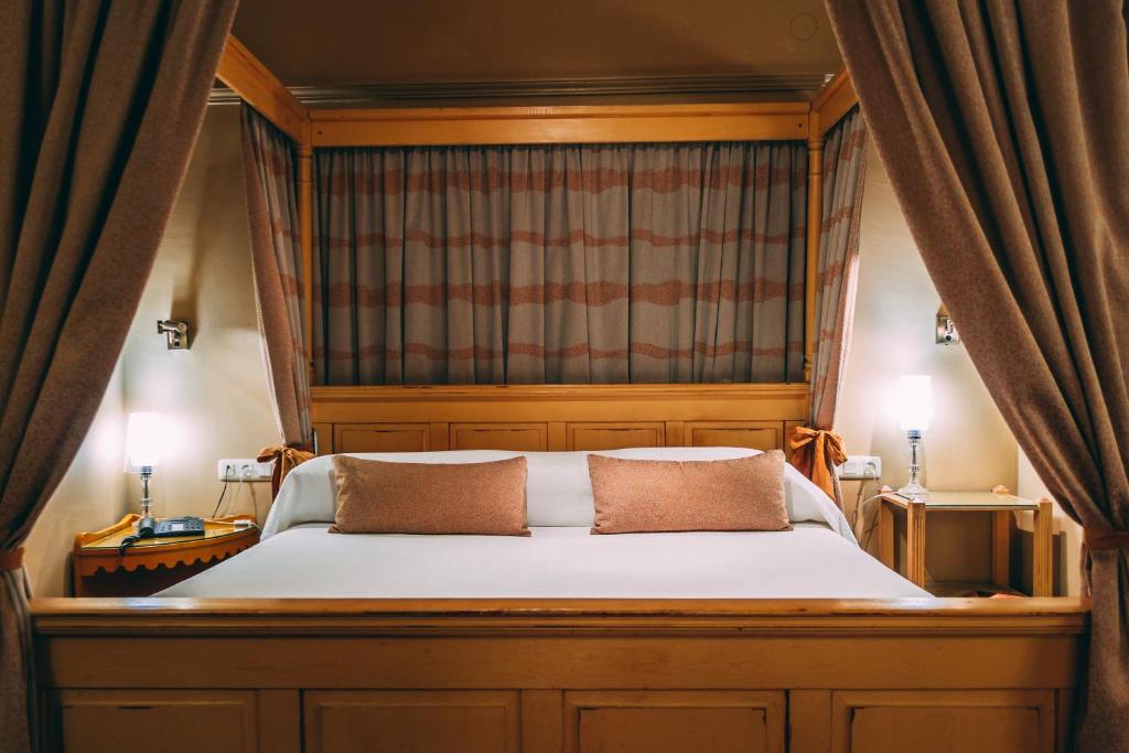 Postel nebo postele na pokoji v ubytování Hotel Carabeo