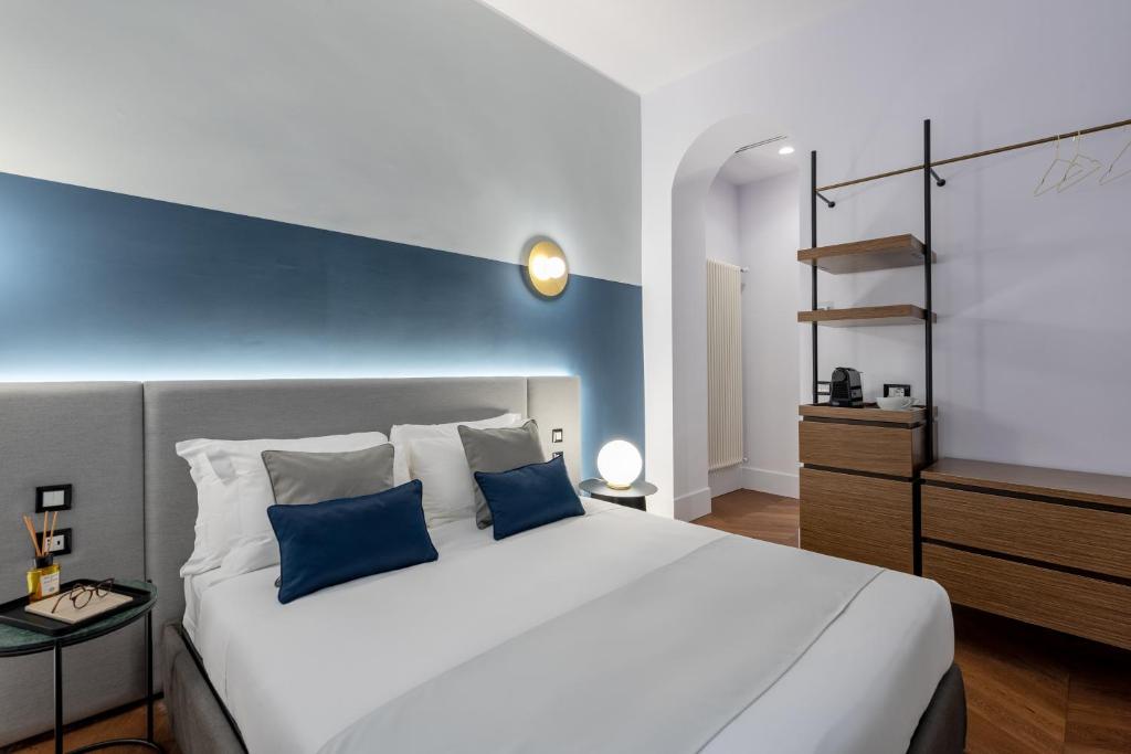 A bed or beds in a room at M20 Boutique Hotel