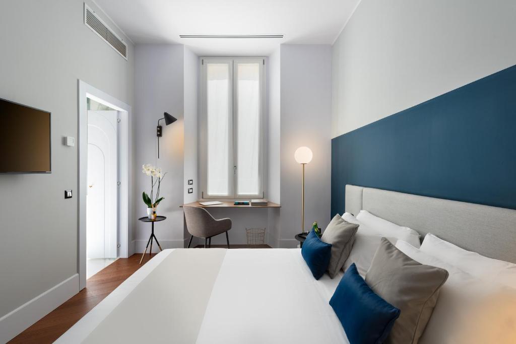 A bed or beds in a room at M20 Boutique Hotel