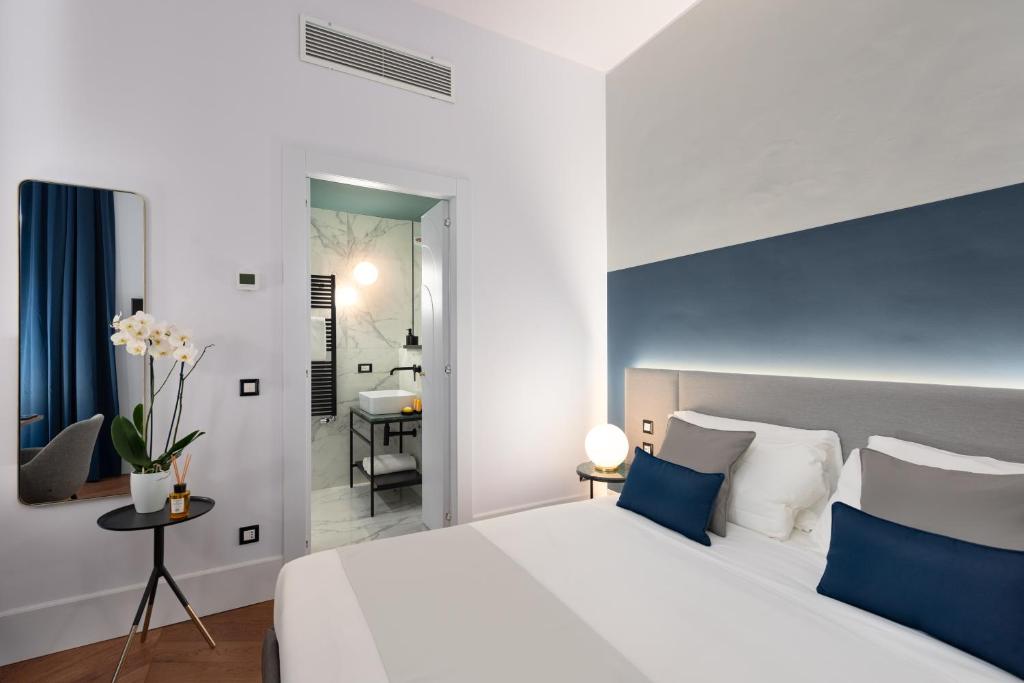 A bed or beds in a room at M20 Boutique Hotel