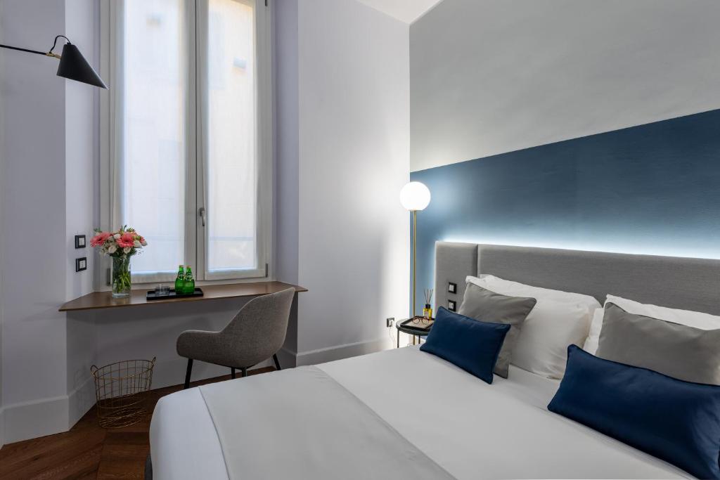 A bed or beds in a room at M20 Boutique Hotel