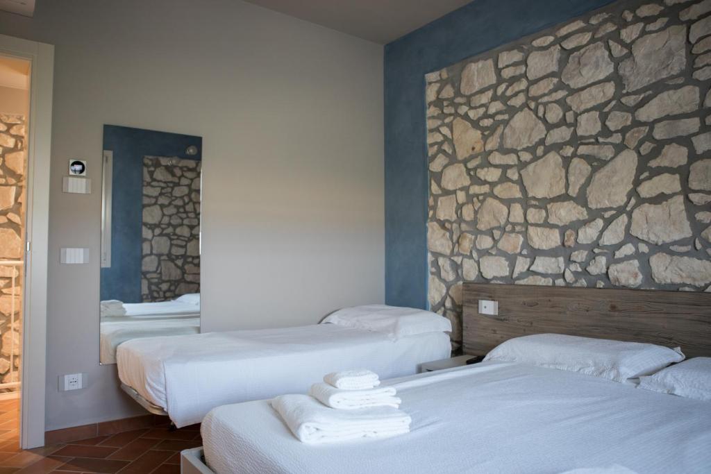 A bed or beds in a room at B&B Casa Campagnari