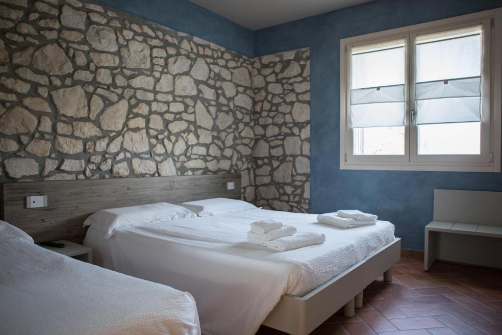 A bed or beds in a room at B&B Casa Campagnari