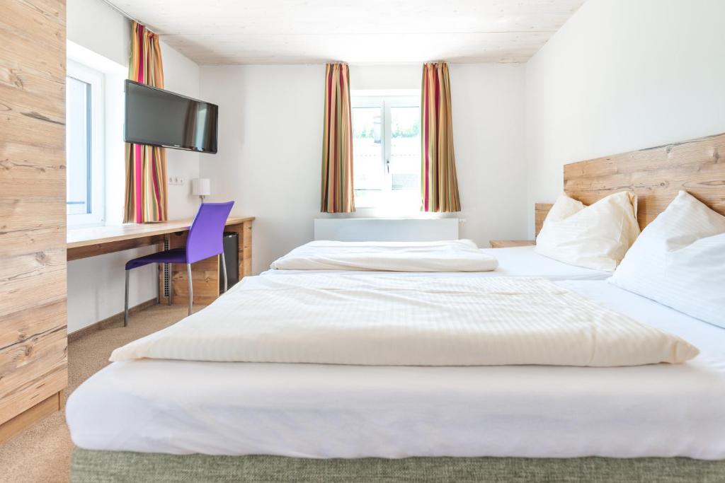 Postel nebo postele na pokoji v ubytování Motel Engel - self checkin
