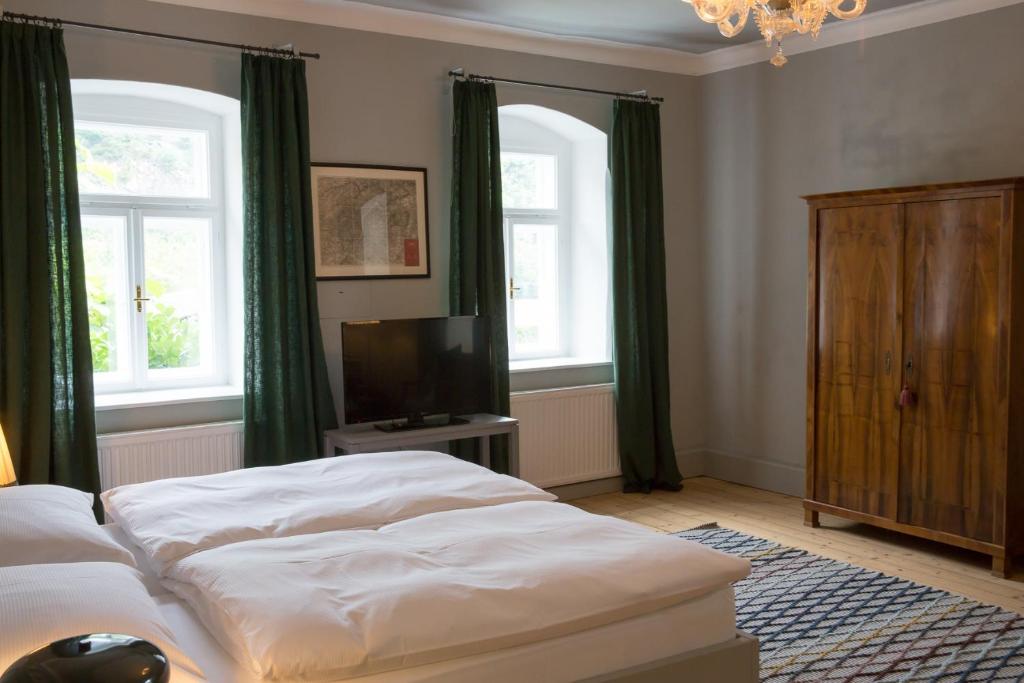Postel nebo postele na pokoji v ubytování Renaissancehof Wieser Wachau