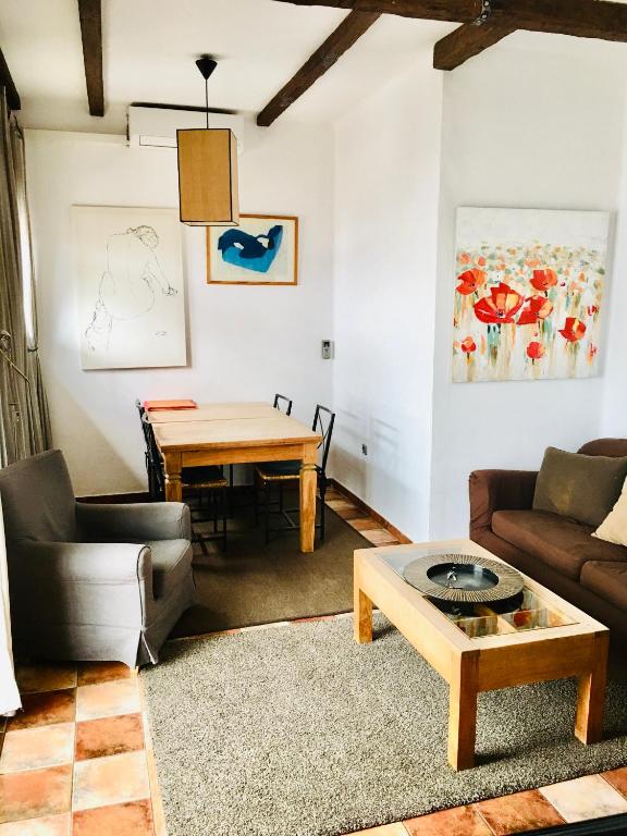 a living room with a couch and a table at Barceloneta Ramblas Apartments in Barcelona
