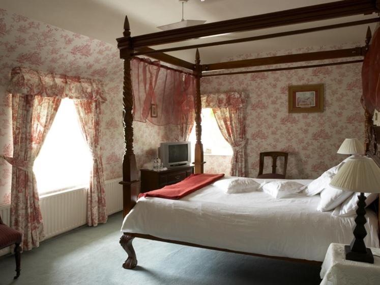 Postel nebo postele na pokoji v ubytování Carrygerry Country House