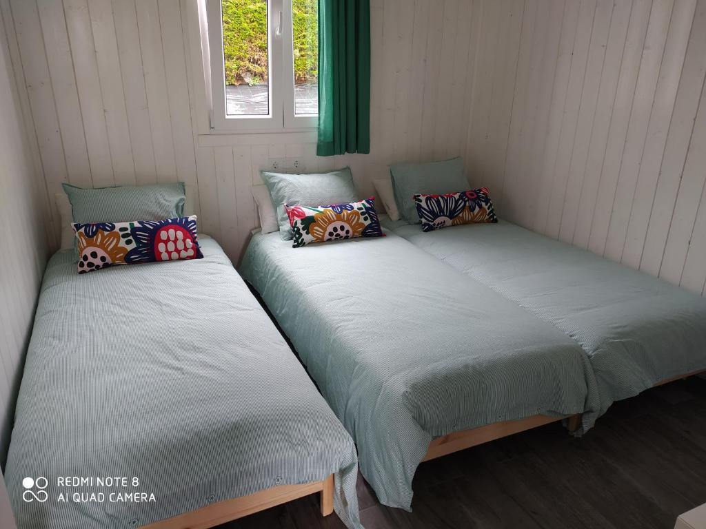 Postel nebo postele na pokoji v ubytování Cabanas de Vendaval