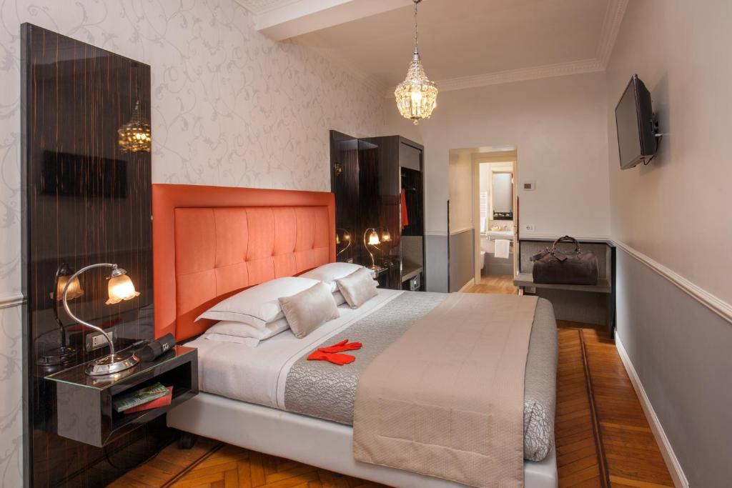 Ein Bett oder Betten in einem Zimmer der Unterkunft Hotel Alexandra