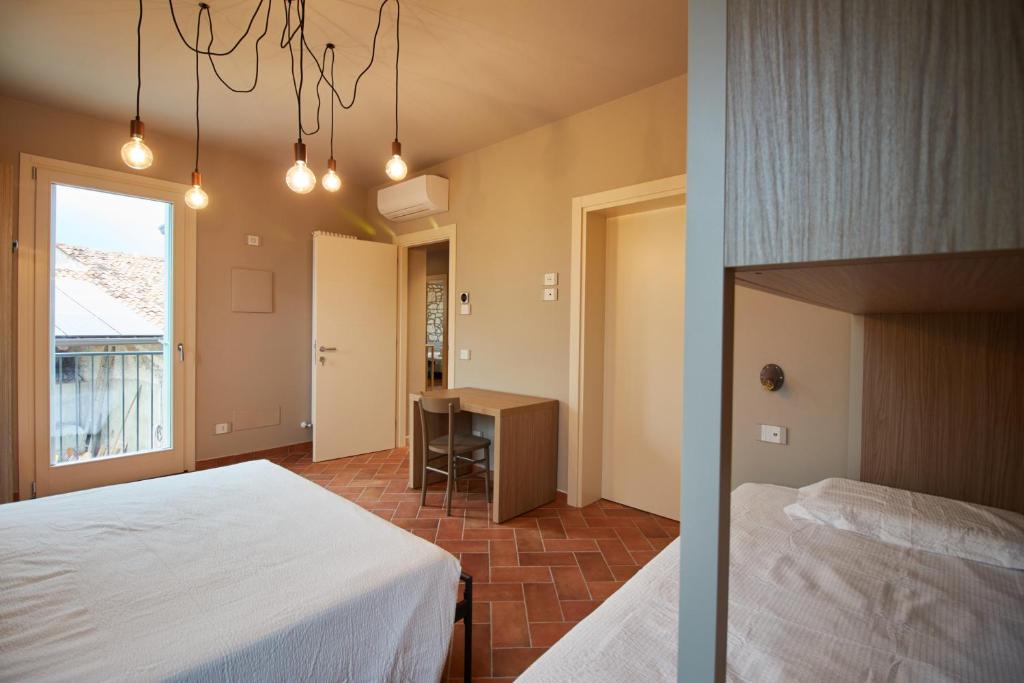 A bed or beds in a room at B&B Casa Campagnari
