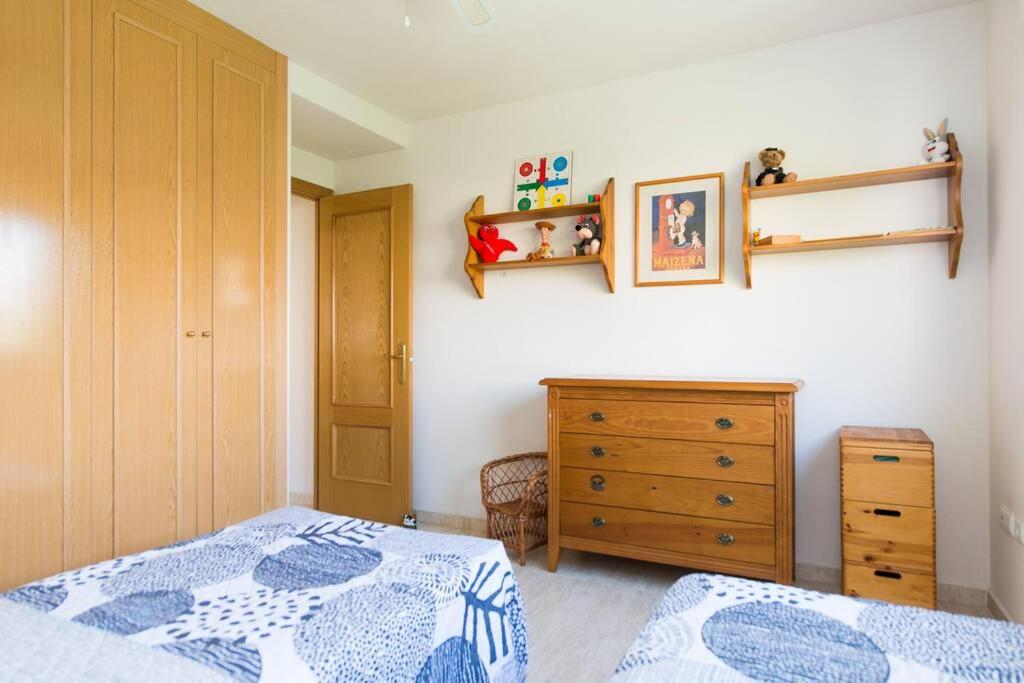 A bed or beds in a room at Happy Holiday Home! 2 pools - Walk to Town & Beach