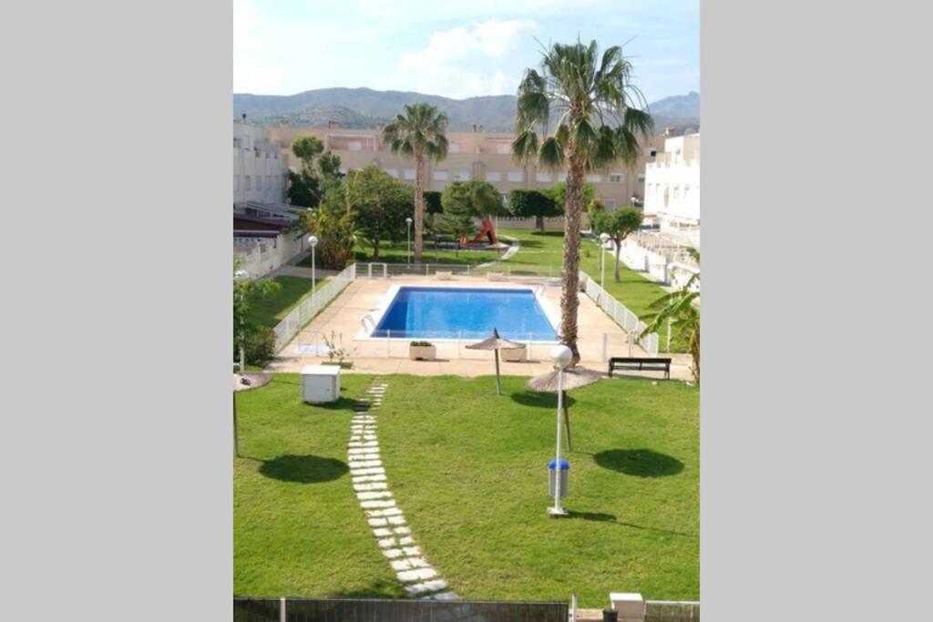 The swimming pool at or close to Happy Holiday Home! 2 pools - Walk to Town & Beach