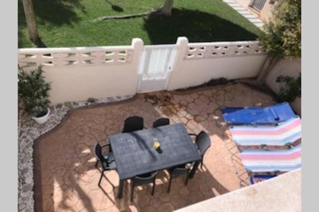 A balcony or terrace at Happy Holiday Home! 2 pools - Walk to Town & Beach