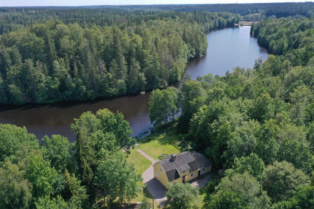 an aerial view of a house in the middle of a river at Holiday Home Småland Paradiset in Ryd