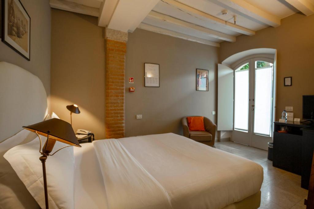 Postel nebo postele na pokoji v ubytování Santellone Resort