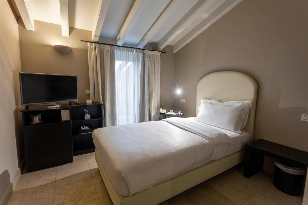 Postel nebo postele na pokoji v ubytování Santellone Resort