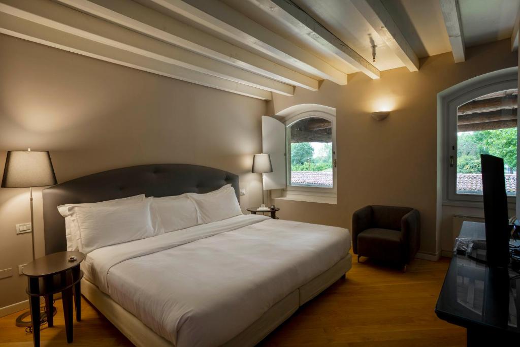 Postel nebo postele na pokoji v ubytování Santellone Resort