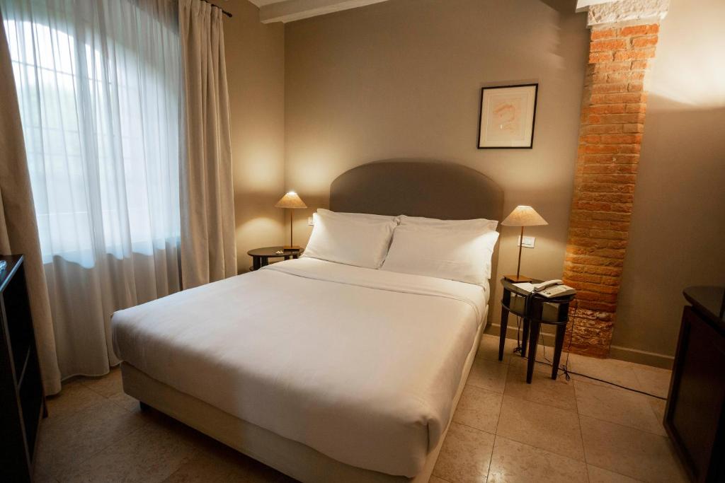 Postel nebo postele na pokoji v ubytování Santellone Resort