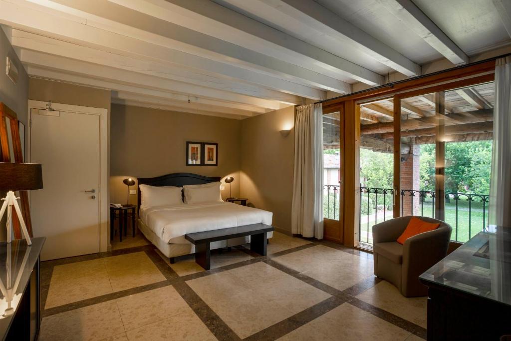 Postel nebo postele na pokoji v ubytování Santellone Resort