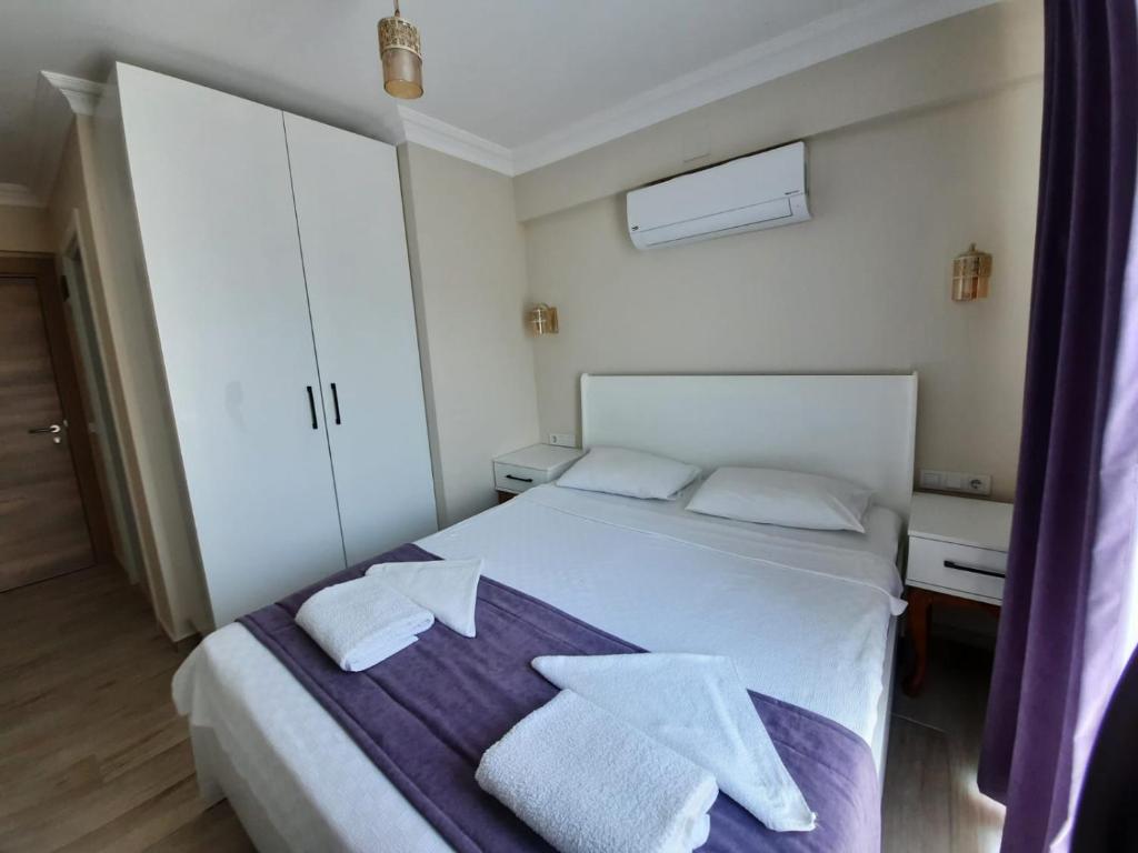 Postel nebo postele na pokoji v ubytování Vespera hotel