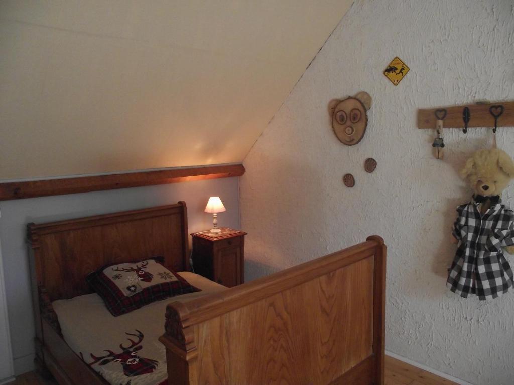 Postel nebo postele na pokoji v ubytování chambres du grès rouge de Beauval