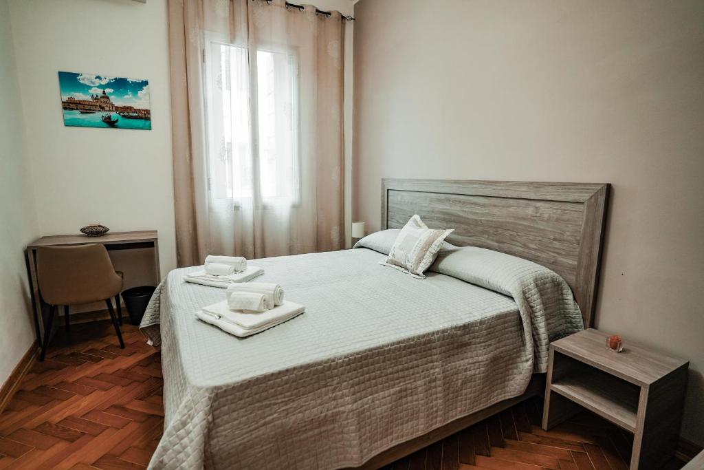 Łóżko lub łóżka w pokoju w obiekcie Angelica Home