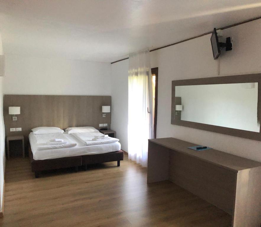 Łóżko lub łóżka w pokoju w obiekcie Park Hotel Miramonti