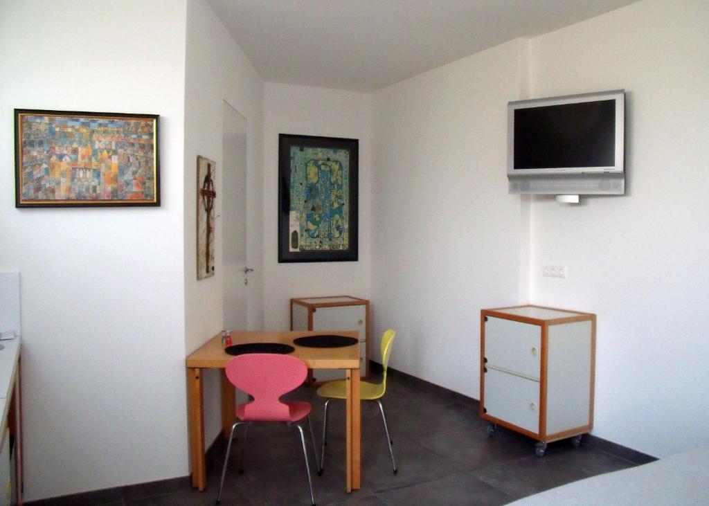 Televízia a/alebo spoločenská miestnosť v ubytovaní Scherer Living