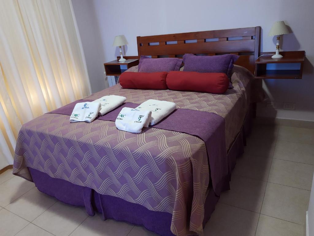 מיטה או מיטות בחדר ב-Apart Agustina