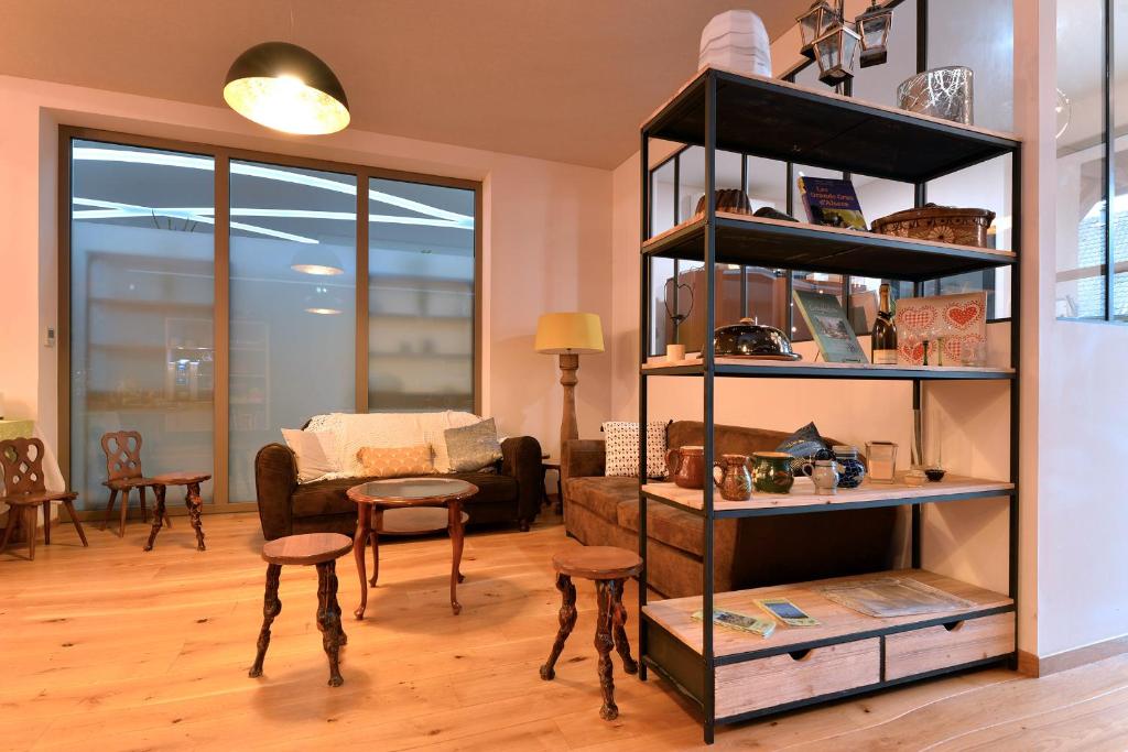 Posezení v ubytování L'éclos des vignes - Appartements haut de gamme avec Spa