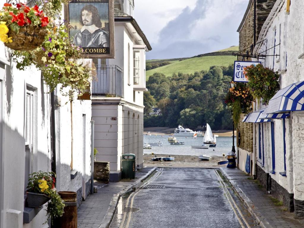 an alley in a town with a view of the water at The Fortescue Inn Salcombe in Salcombe