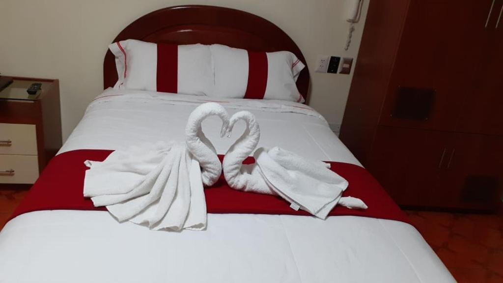 Postel nebo postele na pokoji v ubytování Hotel Wayra
