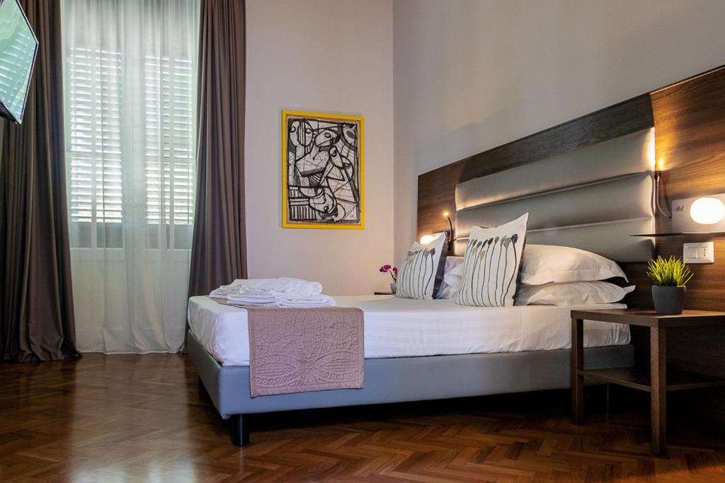 Postel nebo postele na pokoji v ubytování Re Vittorio De Luxe