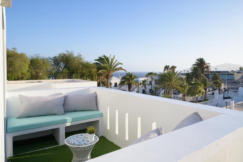 a white balcony with a bench on the roof at Buenavista Ocean View in Puerto del Carmen