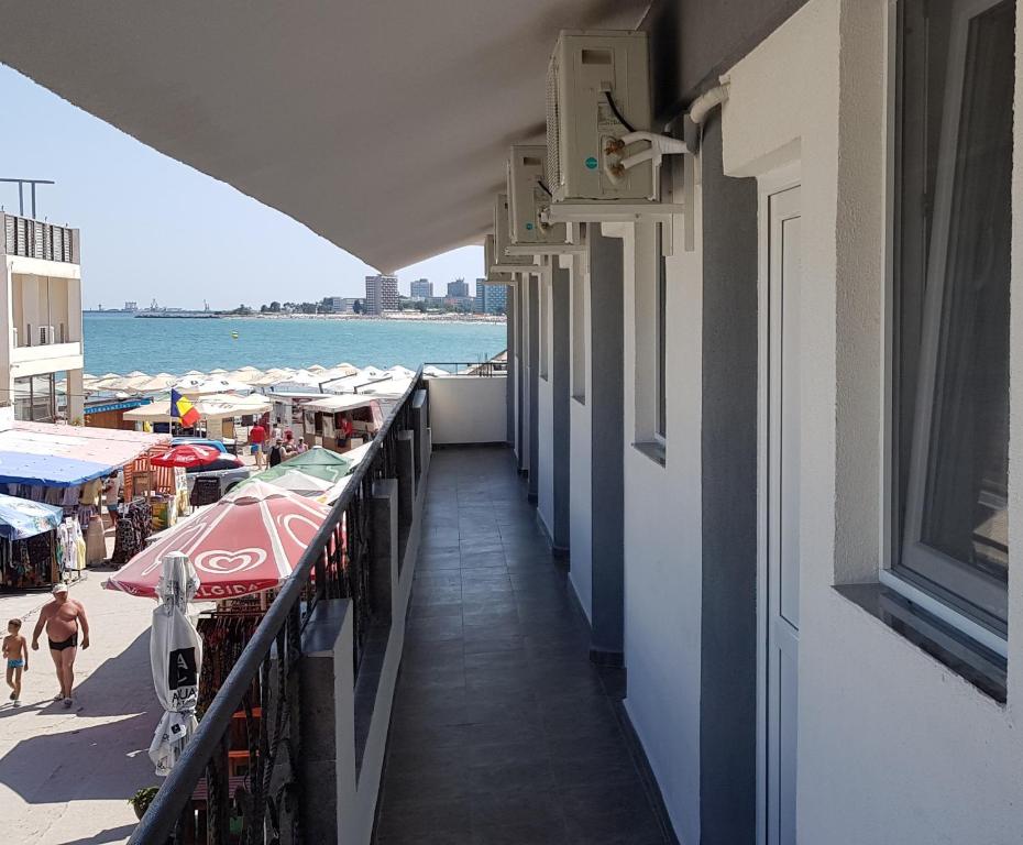 a balcony of a building with a view of the beach at Vila Marea Venusului in Venus