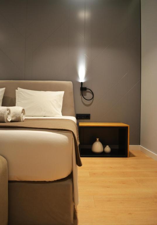 Postel nebo postele na pokoji v ubytování ArtNest Luxury Hotel & Suites