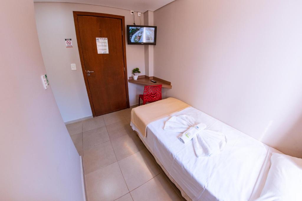 Postel nebo postele na pokoji v ubytování Hotel Ipiranga Maringa