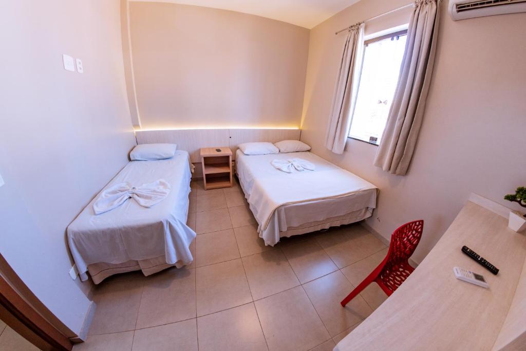 Postel nebo postele na pokoji v ubytování Hotel Ipiranga Maringa