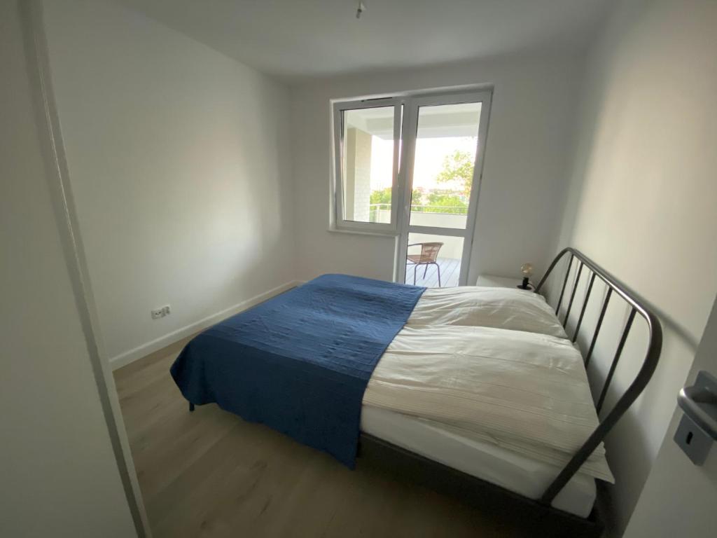 Postel nebo postele na pokoji v ubytování Rodzinny Apartament Platany Centrum