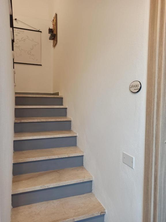 a staircase with blue steps in a room at bedandclimbing in Baunei