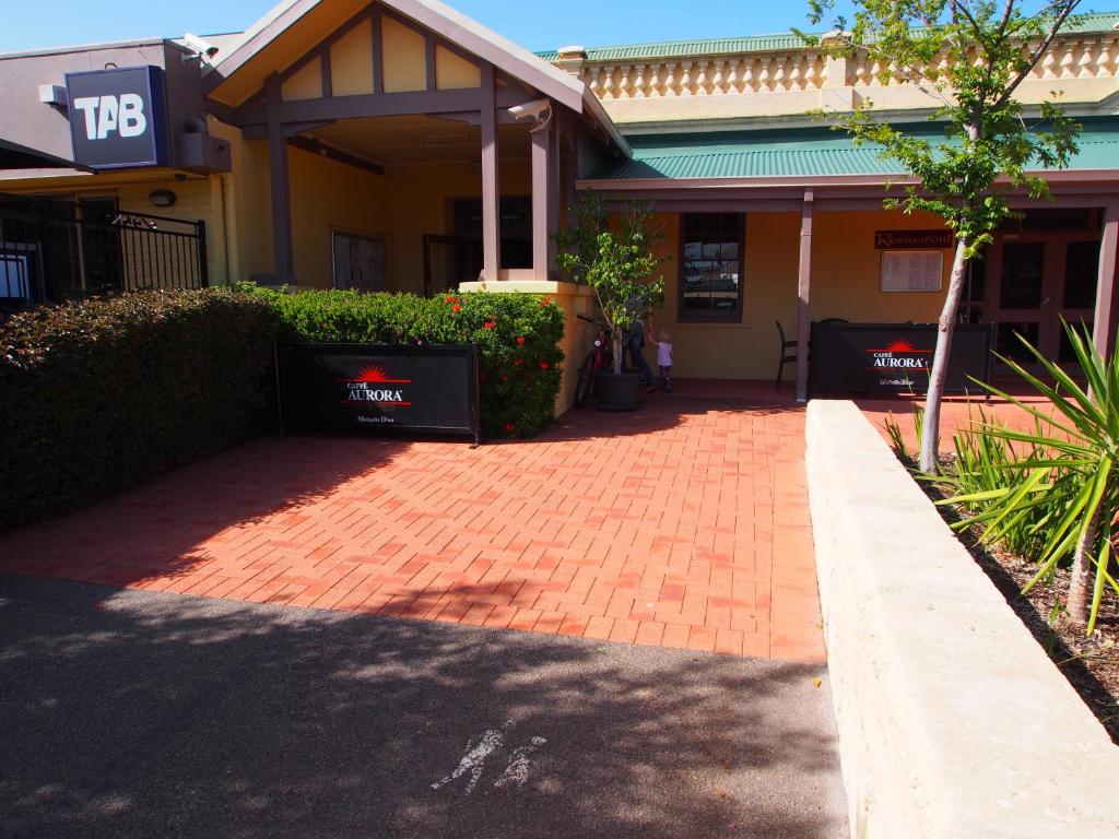 a brick driveway in front of a house at Dongara Hotel Motel in Dongara