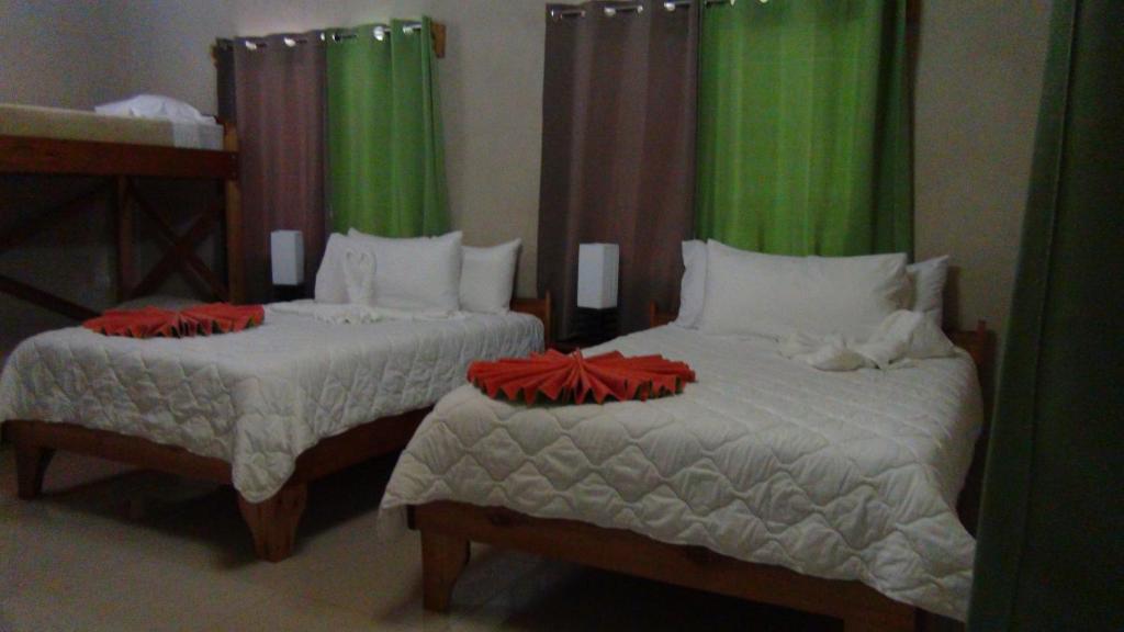Postel nebo postele na pokoji v ubytování Mountain Faro Hotel