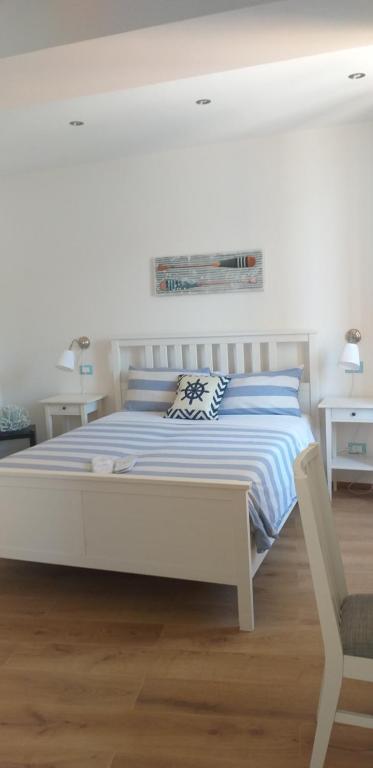 A bed or beds in a room at Affittacamere Il Timone