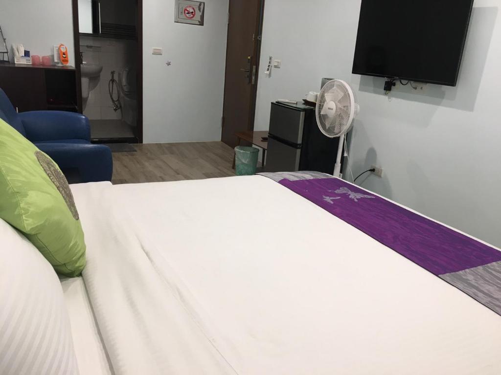 Postel nebo postele na pokoji v ubytování 恆玖民宿 Heng Jiou Homestay