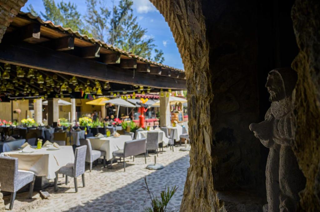 En restaurant eller et andet spisested på Villa Toscana ValQuirico Lofts & Suites Hotel Boutique