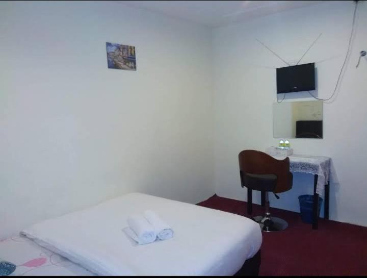 Postel nebo postele na pokoji v ubytování Hotel Tropicanna Pulai Point
