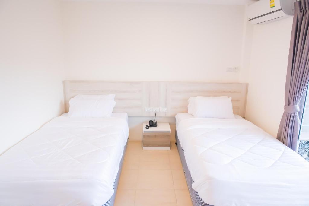 Postel nebo postele na pokoji v ubytování Mystays Phuket
