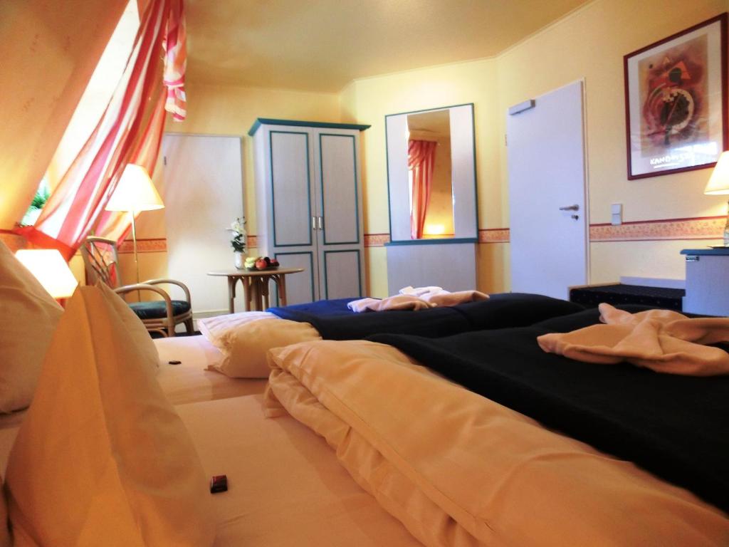 Postel nebo postele na pokoji v ubytování Hotel Nordic