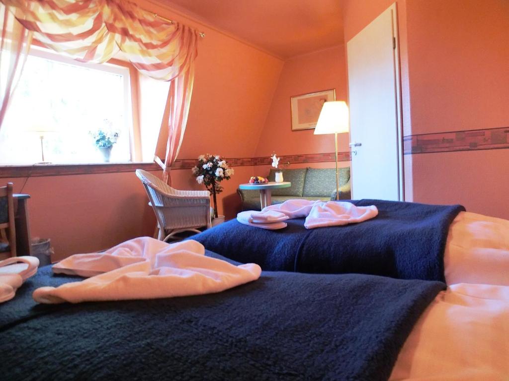 Postel nebo postele na pokoji v ubytování Hotel Nordic